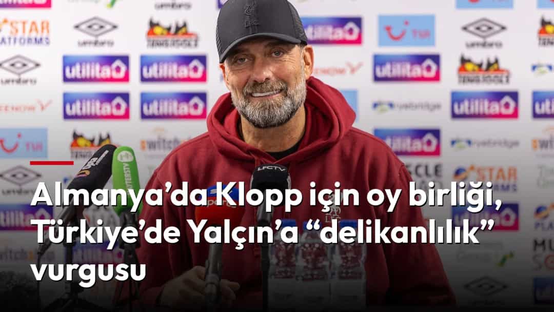 Jürgen Klopp, basın toplantısında mikrofonlar önünde konuşuyor.