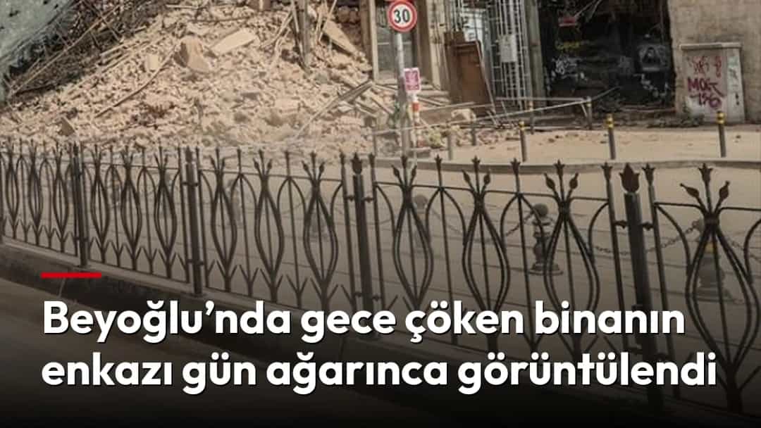 Beyoğlu’nda çöken binanın enkazı, gün ağarırken sokak seviyesinden görüntüleniyor.