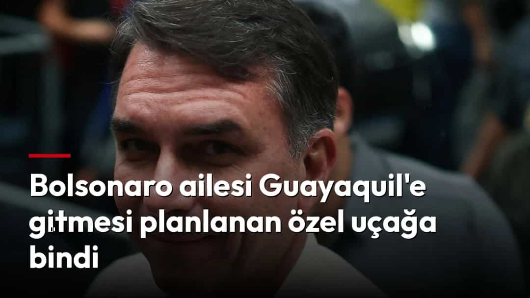 Jair Bolsonaro kalabalık bir ortamda kameraya doğru bakıyor.
