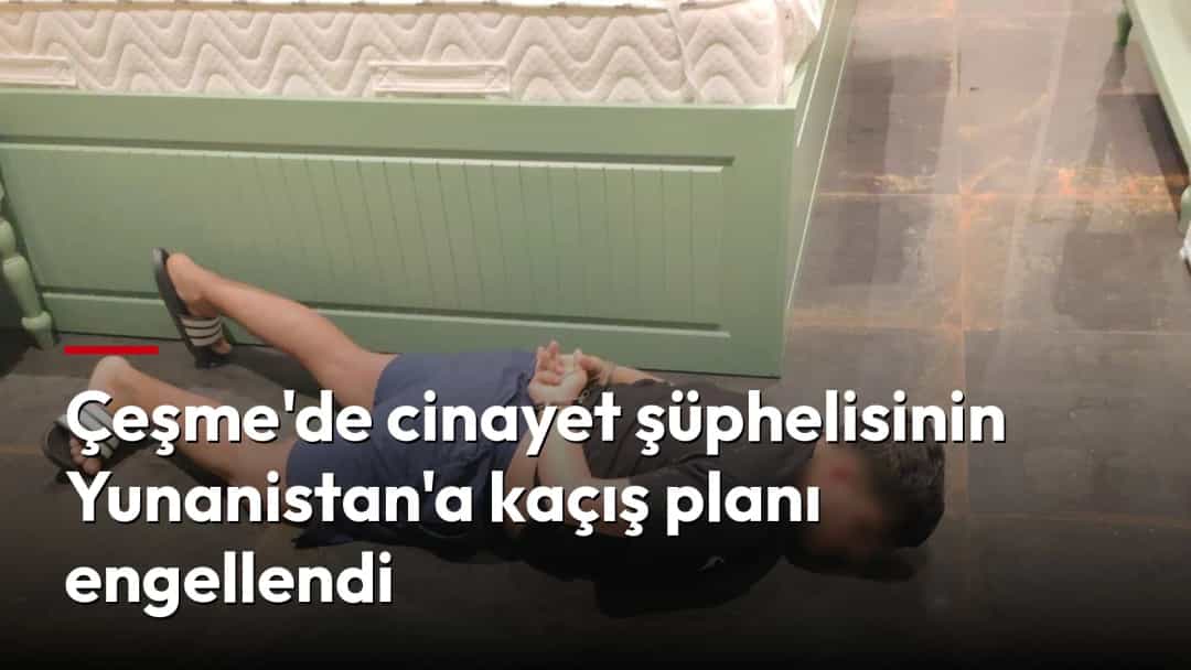 Otel odasında yerde yüzüstü yatan ve elleri kelepçeli bir şüpheli.