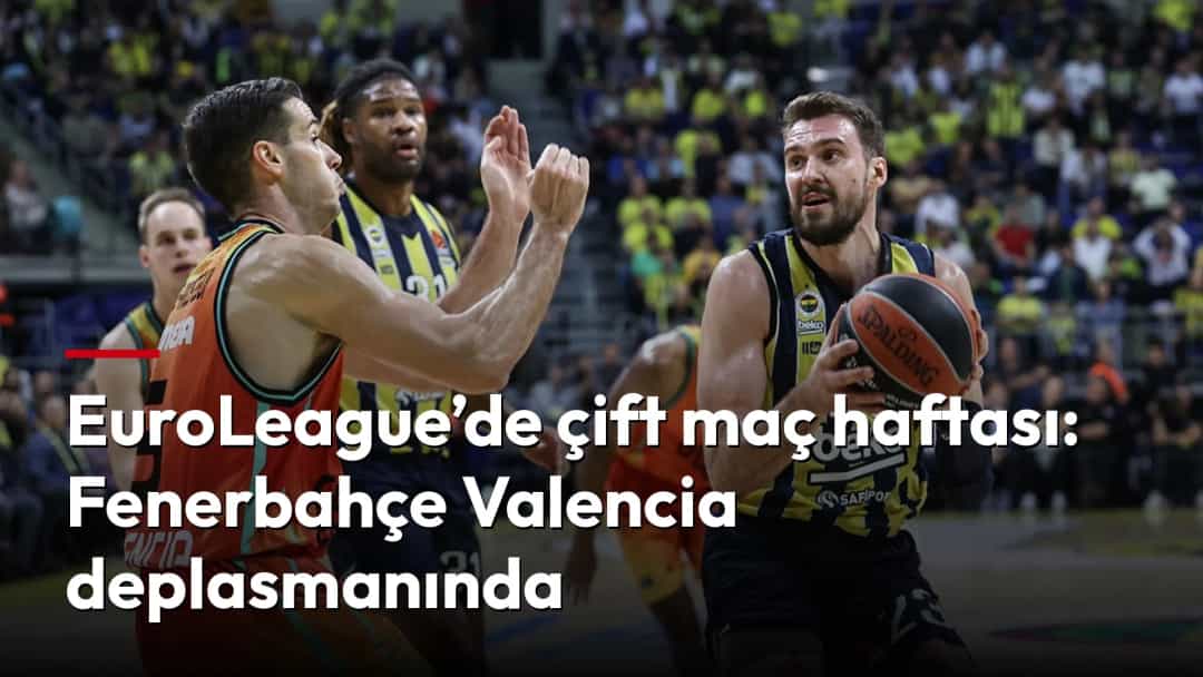 Fenerbahçe oyuncusu, Valencia karşısında topu potaya taşırken.