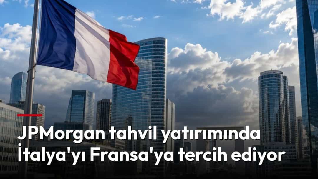 Paris’in iş bölgesindeki gökdelenler ve önde dalgalanan Fransız bayrağı.