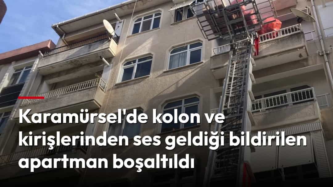 Apartmanın dış cephesinde balkonlara uzanan itfaiye merdiveni görülüyor.