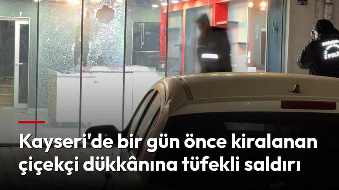 Camları kırılmış bir iş yerinin önünde polis inceleme yapıyor.