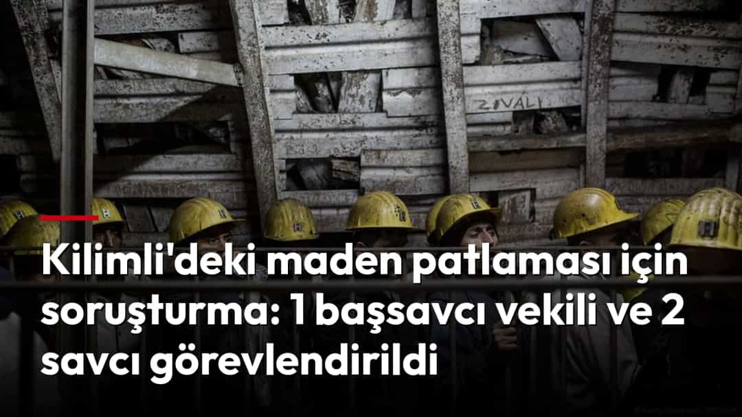 Baretli maden işçileri, ocağa inmek için kafes asansörde sıra bekliyor.