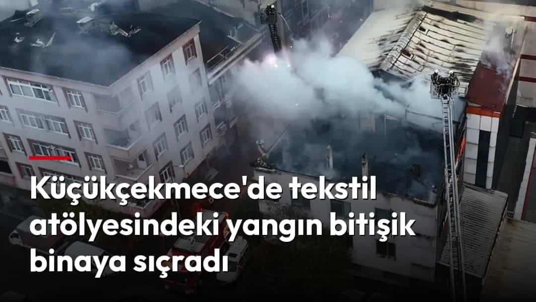 Küçükçekmece'de bir binadaki yangında yoğun duman yükselirken itfaiye ekipleri müdahale ediyor.