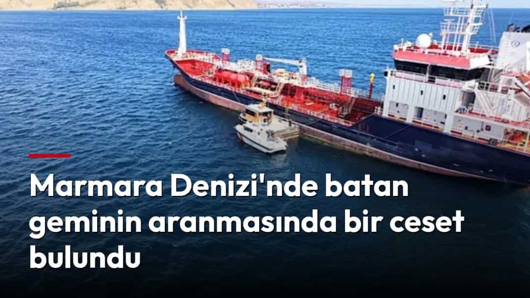 Denizdeki büyük geminin yanında küçük bir tekne