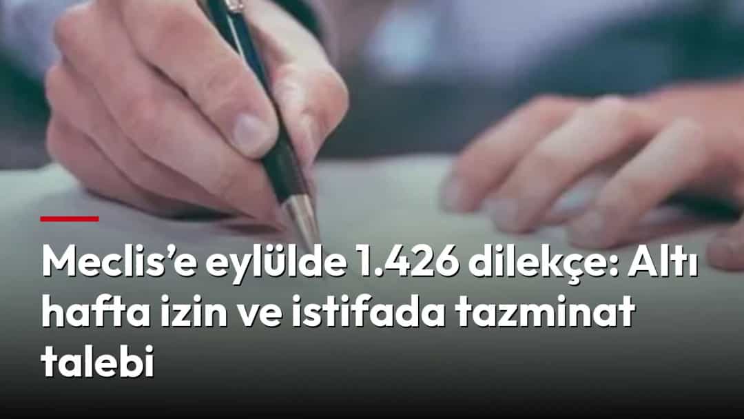 Bir kişi kâğıda kalemle yazı yazıyor.