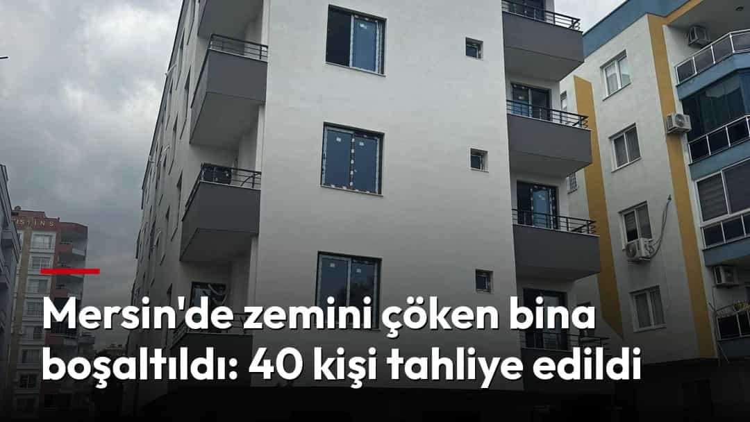 Mersin'de zemini çöken binanın çevresinde toprak yığınları ve güvenlik şeridi görülüyor.