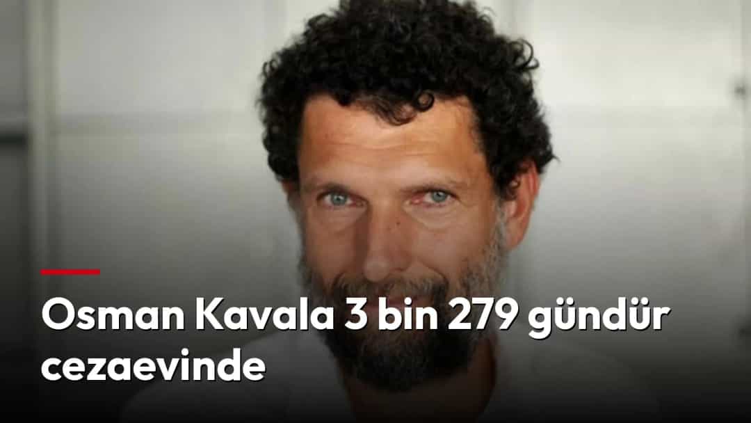 Osman Kavala beyaz gömlekle kameraya bakıyor.