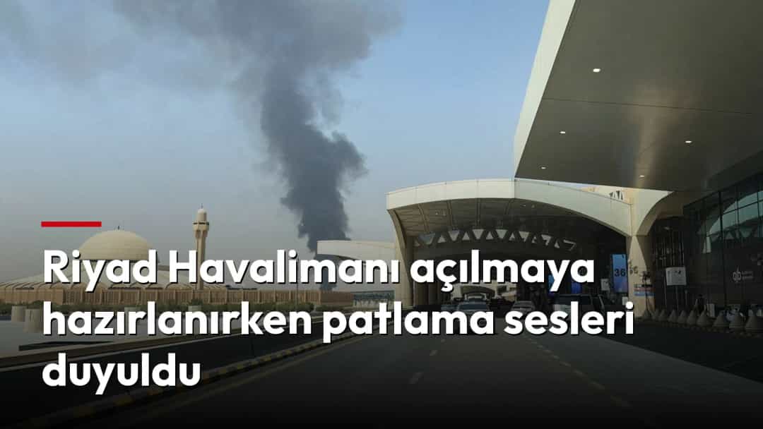Havalimanı terminaline giden yolun yakınında yükselen yoğun siyah duman.
