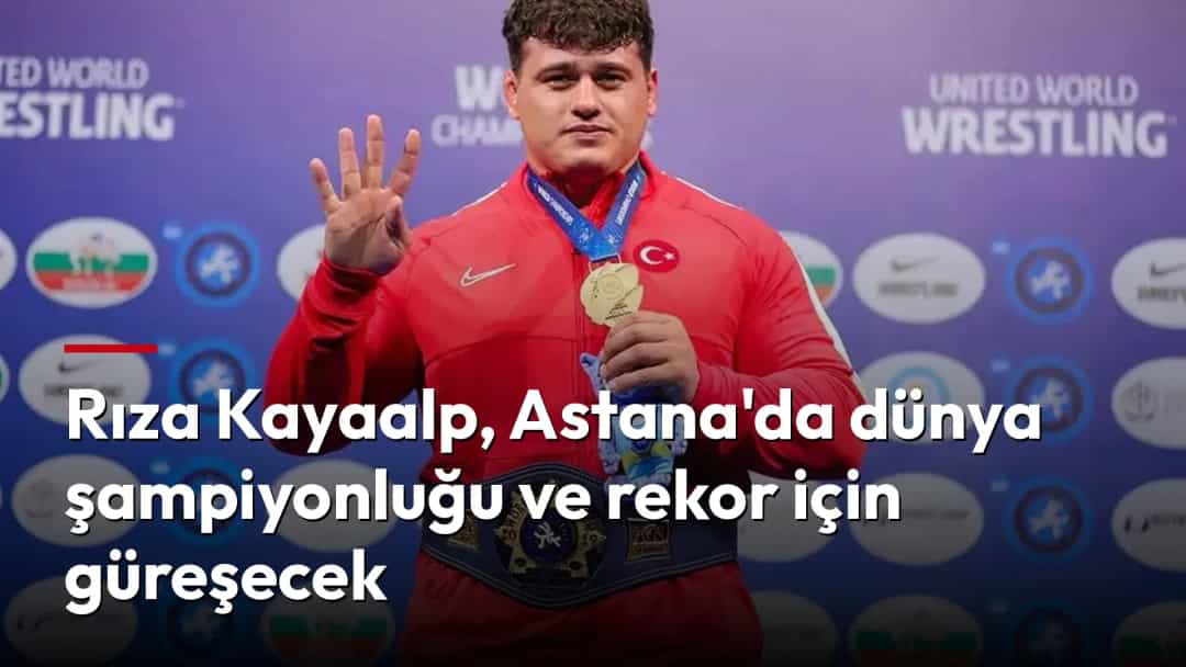 Rıza Kayaalp, madalyasıyla poz verirken.