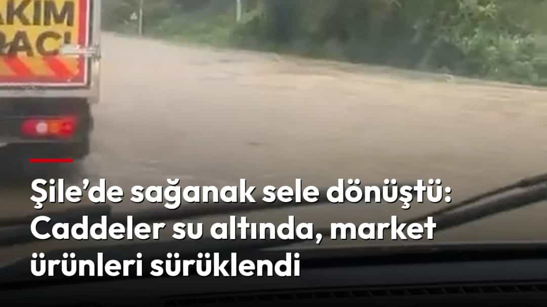 Sağanak sonrası suyla kaplanan caddede araçlar ilerlemeye çalışıyor.