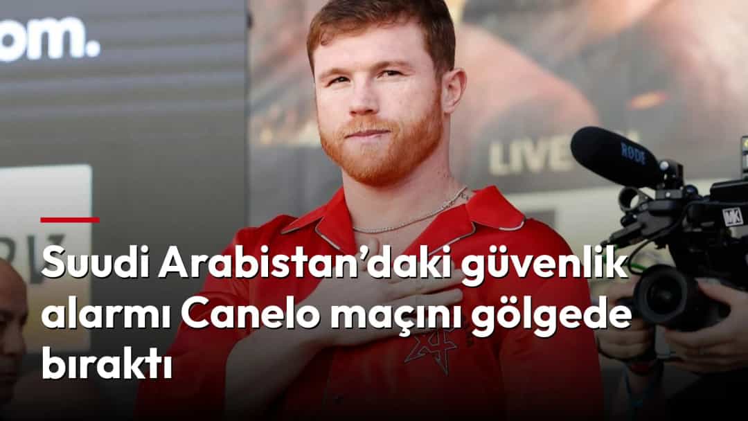Canelo Alvarez, kırmızı kıyafetiyle bir basın etkinliğinde elini göğsüne koyarken