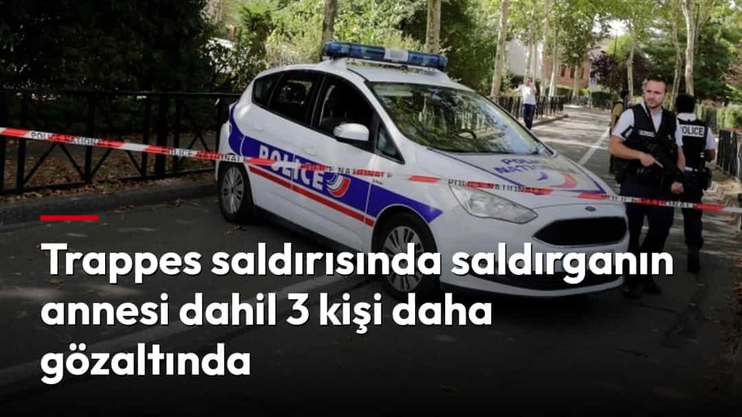 Trappes’te güvenlik şeridiyle kapatılan sokakta polis aracı ve görevliler