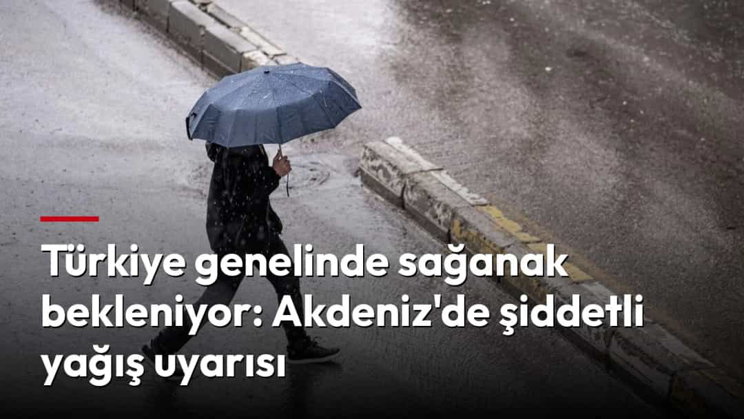 Sağanak yağmurda şemsiyeyle karşıya geçen bir kişi