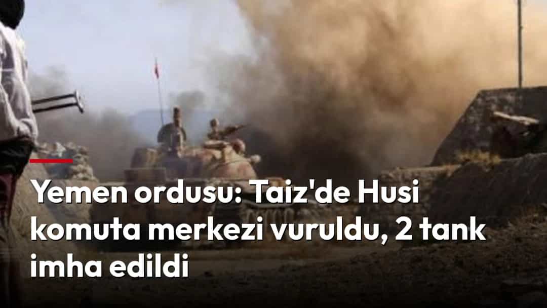 Yükselen dumanın önünde bir tank ve çatışma bölgesinde duran bir kişi.